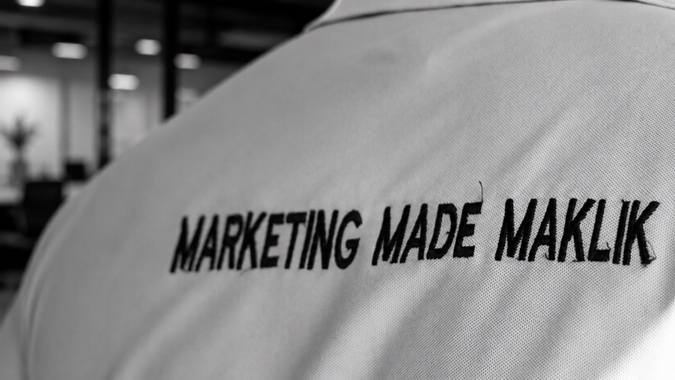 Close-up of Blu Dot Ads apparel embroidered with the words Marketing Made Maklik